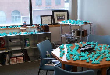 An office where all surfaces are covered in blue peep candies