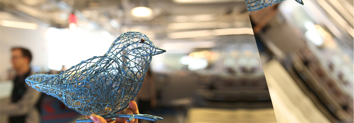 Hand holding a bluebird figuring